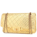 Chanel 2.55 handbag in gold quilted leather