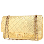 Chanel 2.55 handbag in gold quilted leather