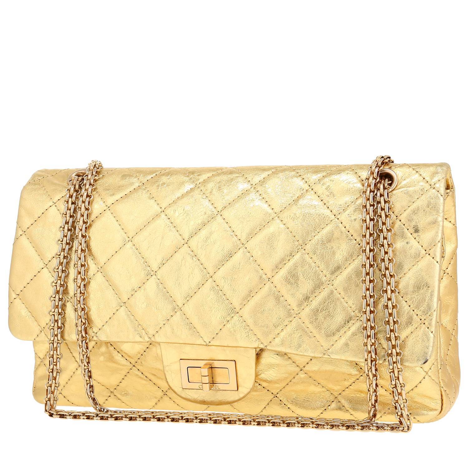 Chanel 2.55 handbag in gold quilted leather