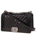 Chanel Boy shoulder bag in black patent leather