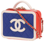 Chanel Filigree Vanity Case shoulder bag in blue, white and red quilted grained leather