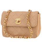 Chanel Mini Timeless shoulder bag in beige quilted leather