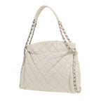 Chanel Petit Shopping handbag in white quilted leather