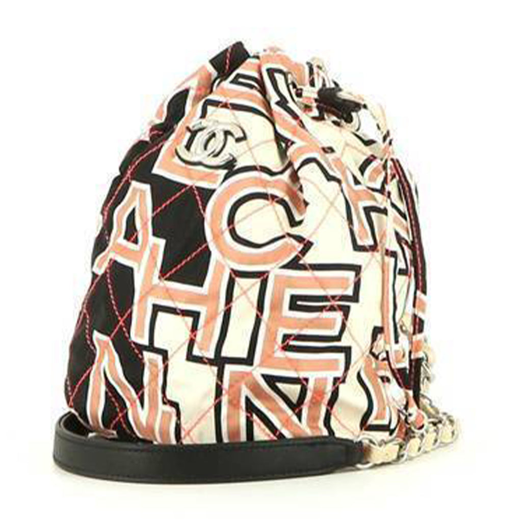 Chanel shoulder bag in pink, white and black logo canvas