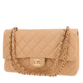 Chanel Timeless Classic handbag in beige quilted leather