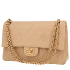 Chanel Timeless Classic handbag in beige quilted leather
