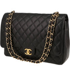 Chanel Timeless Maxi Jumbo handbag in black quilted grained leather
