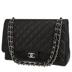 Chanel Timeless Maxi Jumbo handbag in black quilted grained leather