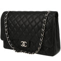Chanel Timeless Maxi Jumbo handbag in black quilted grained leather