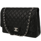 Chanel Timeless Maxi Jumbo handbag in black quilted grained leather