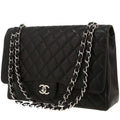 Chanel Timeless Maxi Jumbo handbag in black quilted grained leather