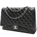 Chanel Timeless Maxi Jumbo handbag in black quilted leather