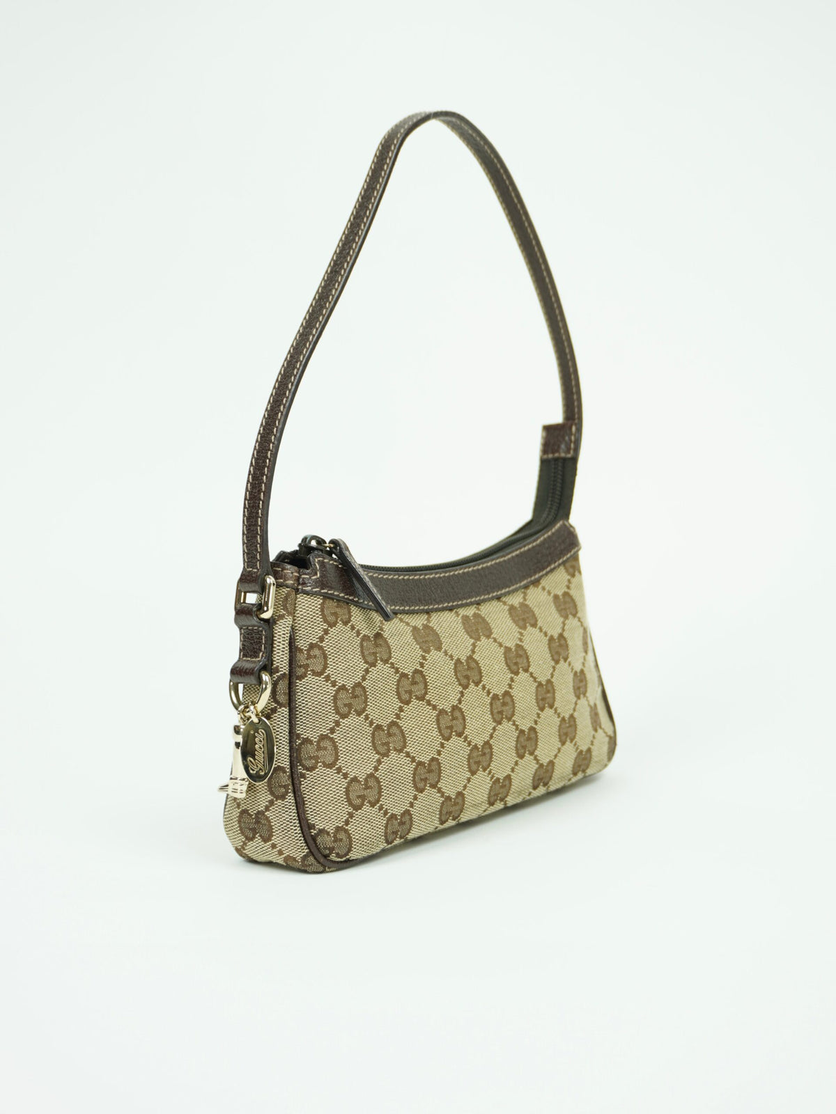GUCCI MONOGRAM BAG WITH CHARM