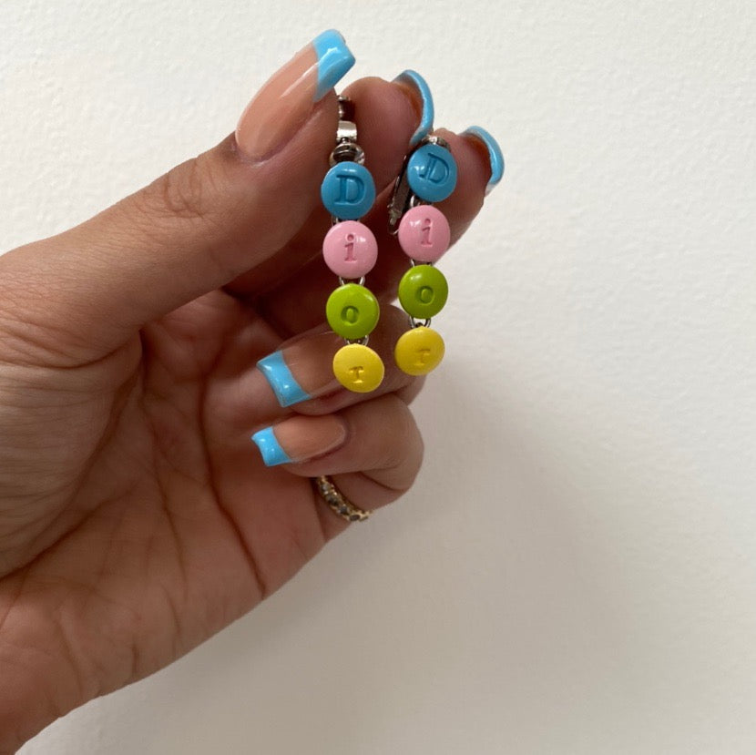 CHRISTIAN DIOR SPELLOUT CLIP ON EARRINGS